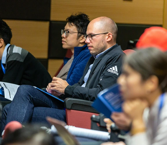 An audience listening to a seminar